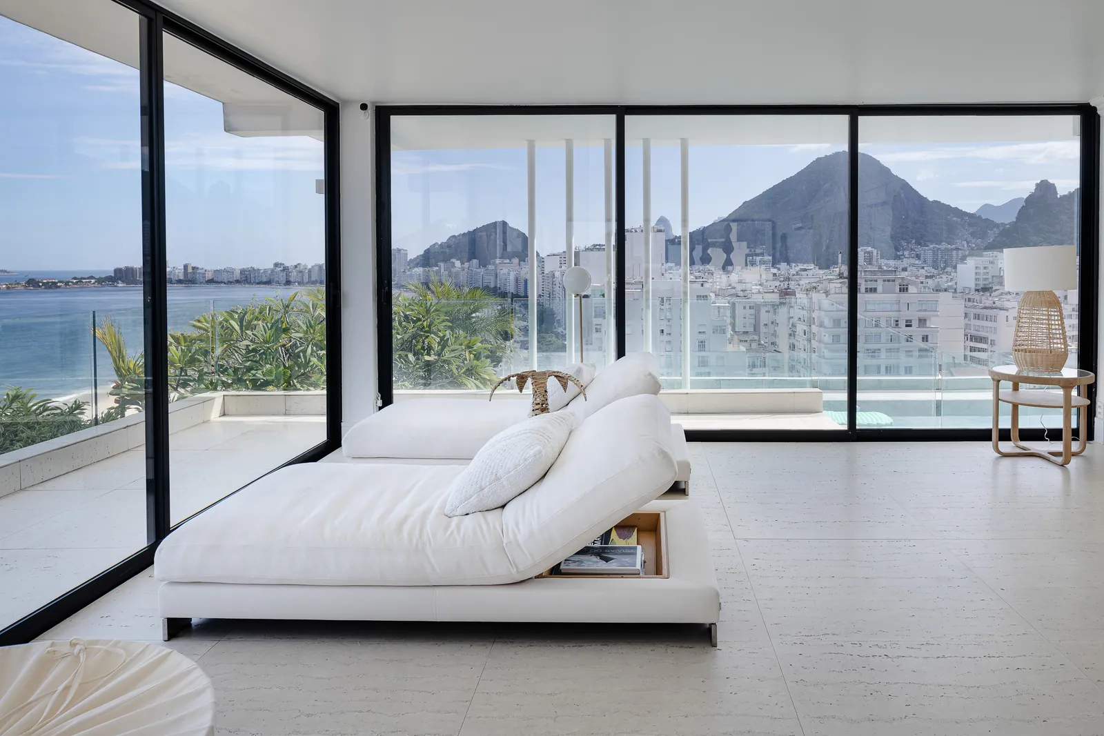 Round dining table and cane chairs against the glass