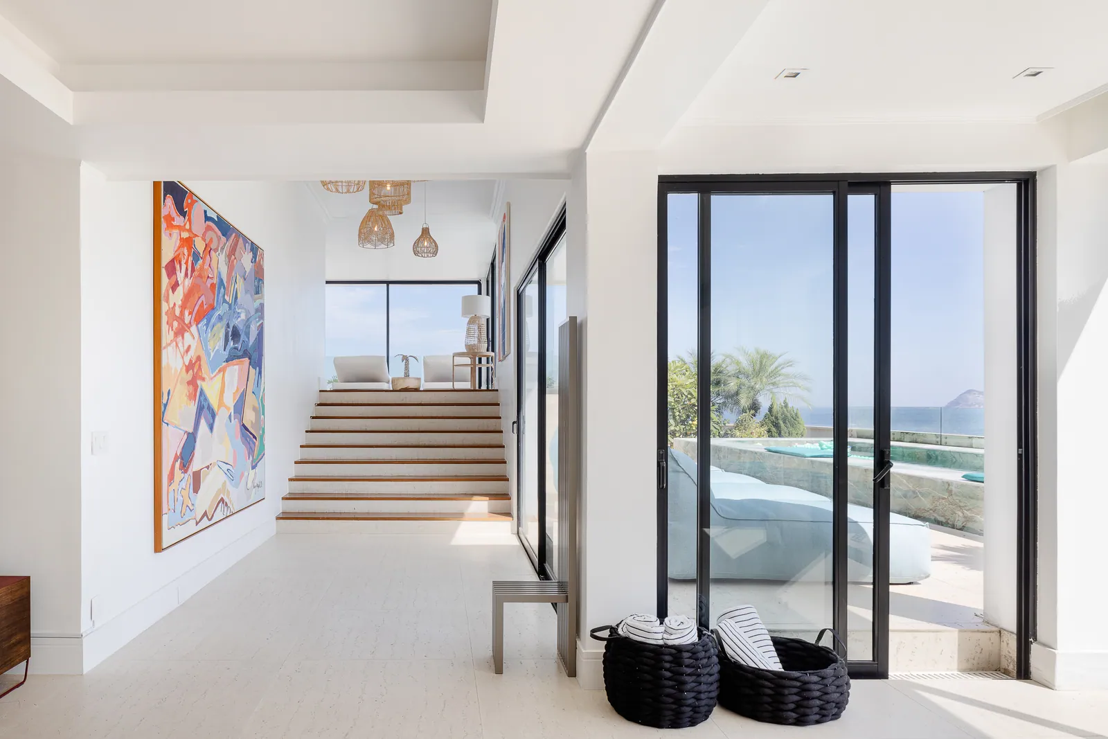 Living room with round mirrors and a contemporary canvas