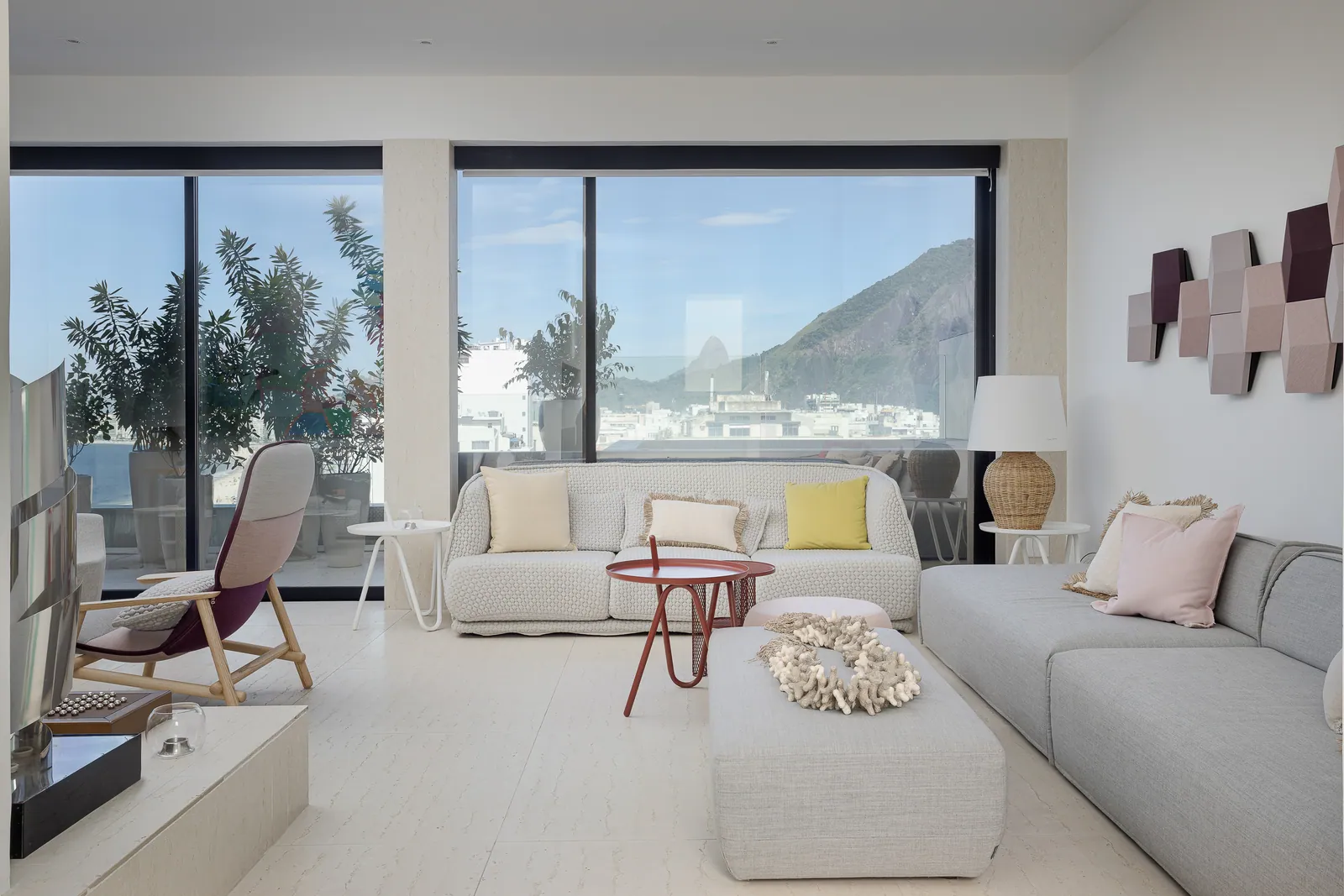 Family room with hexagonal wall panels and low seating
