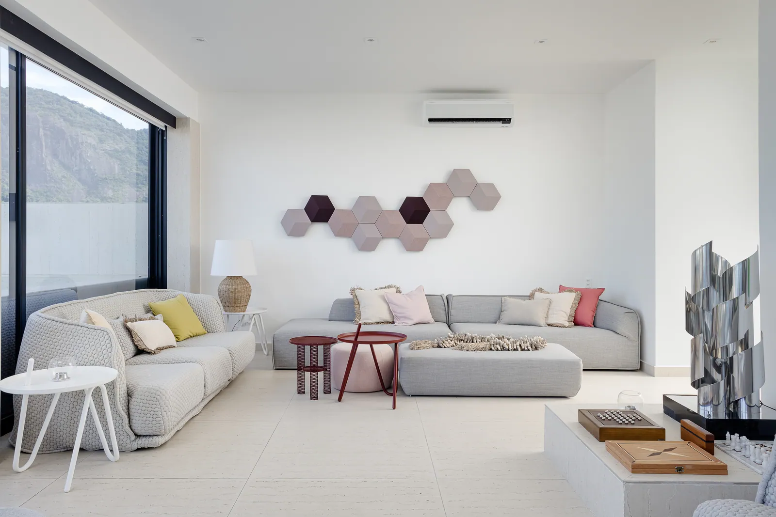 Living room with floral canvas and full-height bookshelves