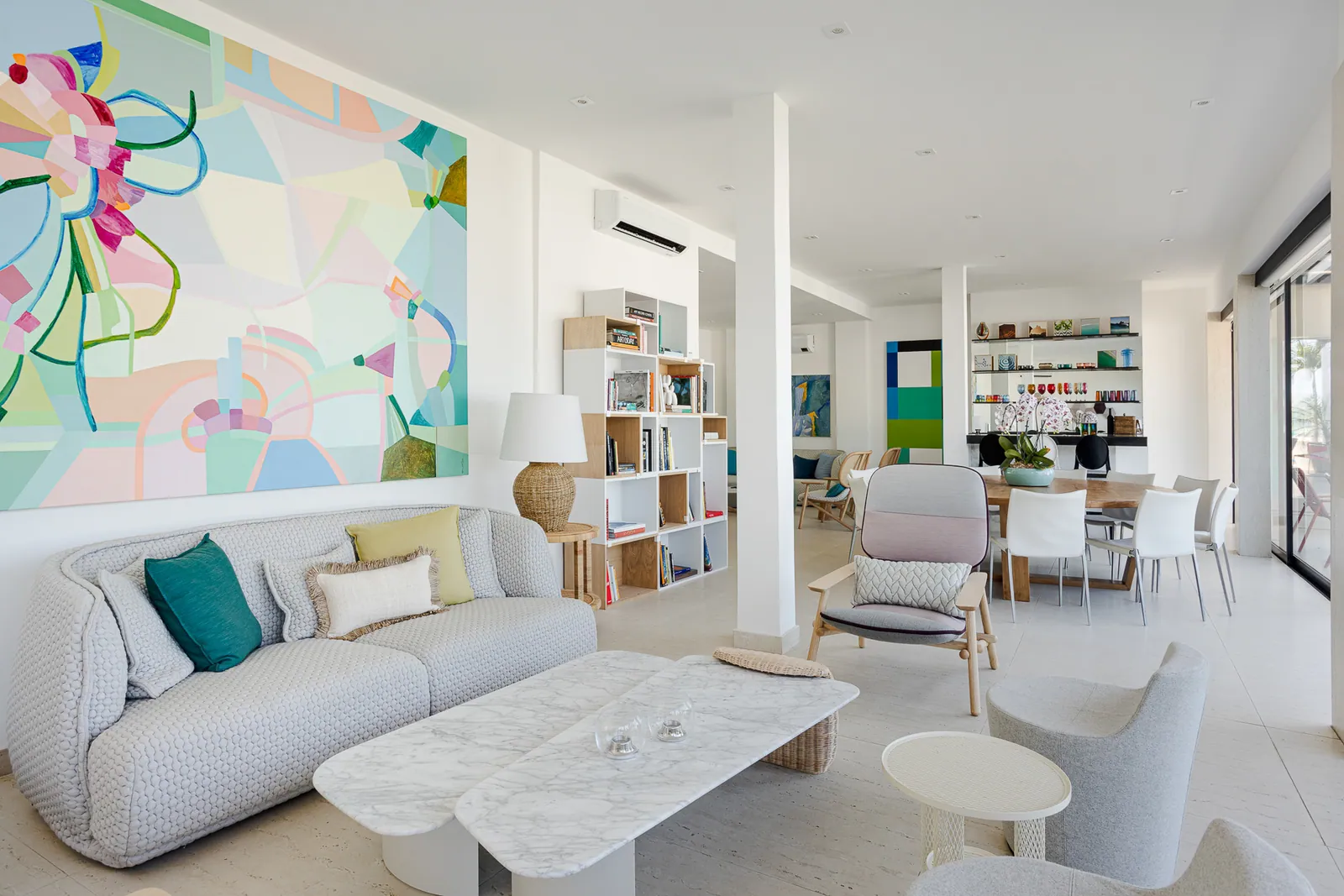 Round dining table and bookshelves in the informal dining room