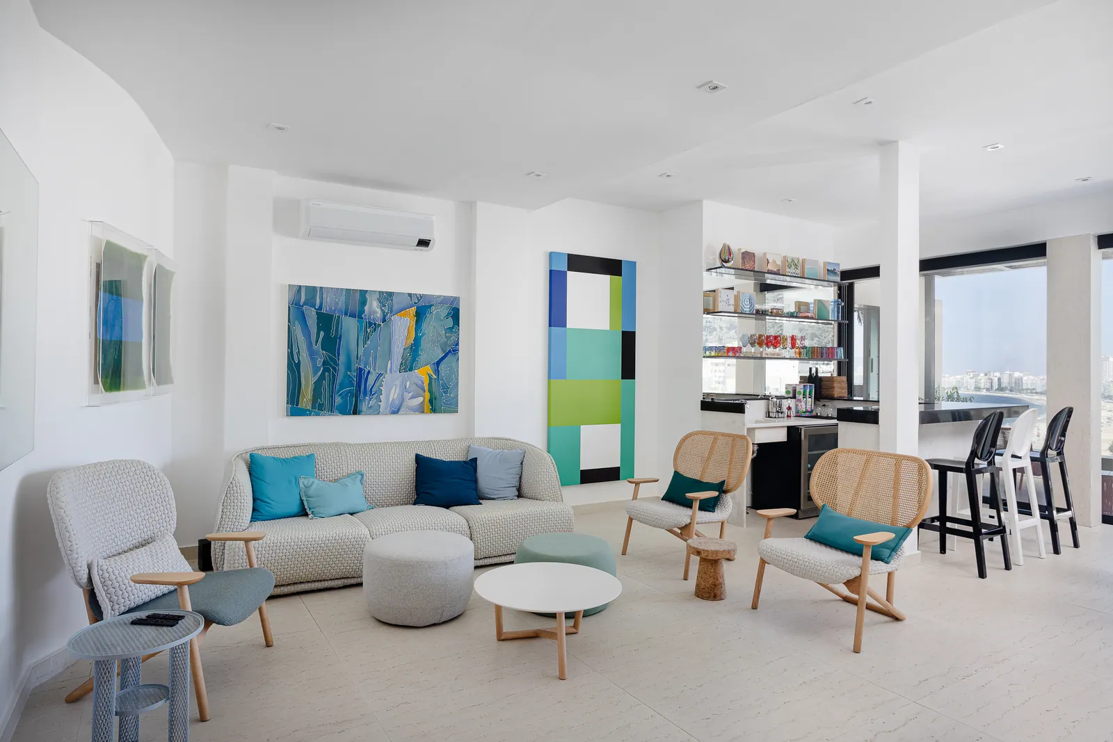 Television lounge with rocking chairs and low stools