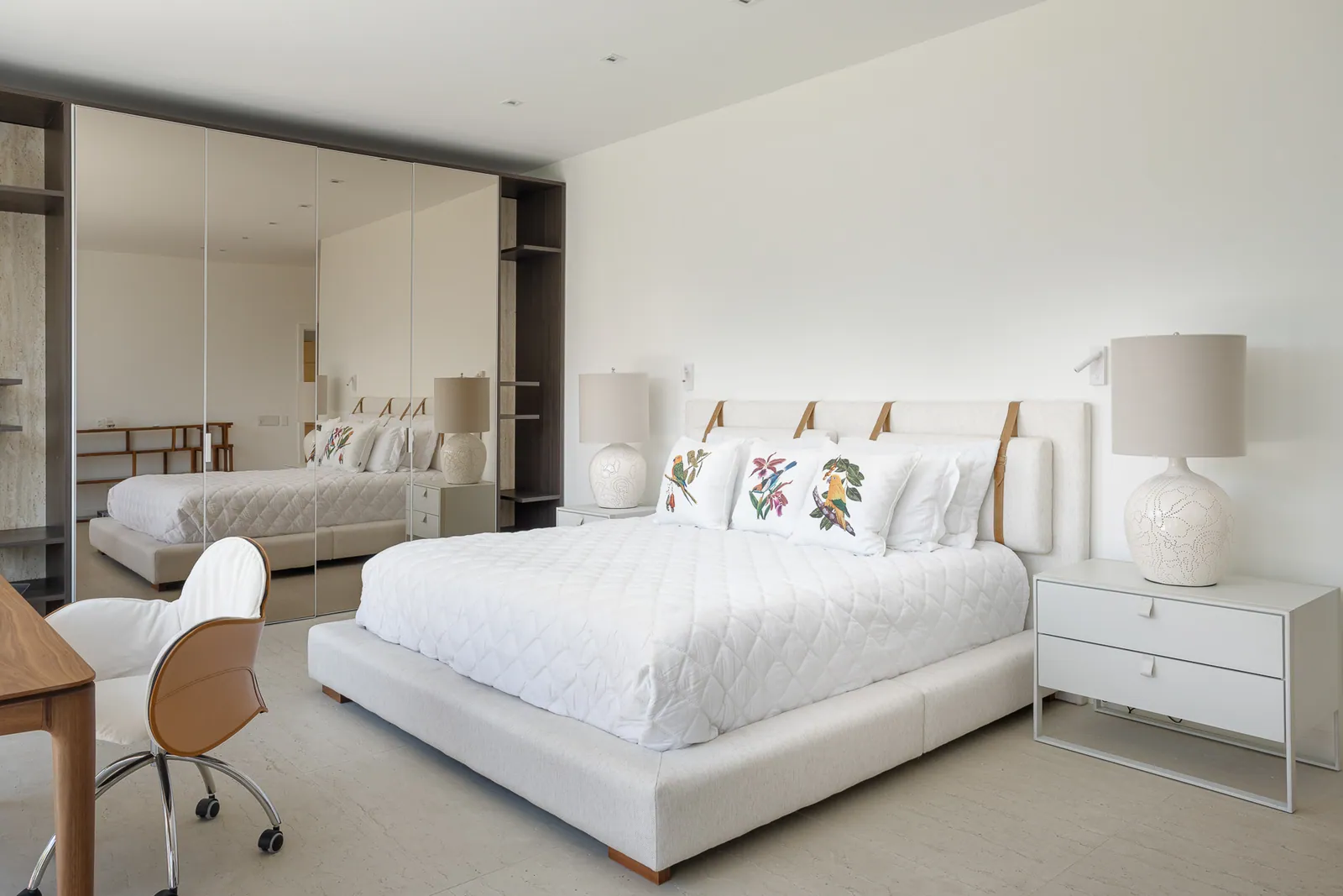 Bedroom with writing desk opening onto a private terrace
