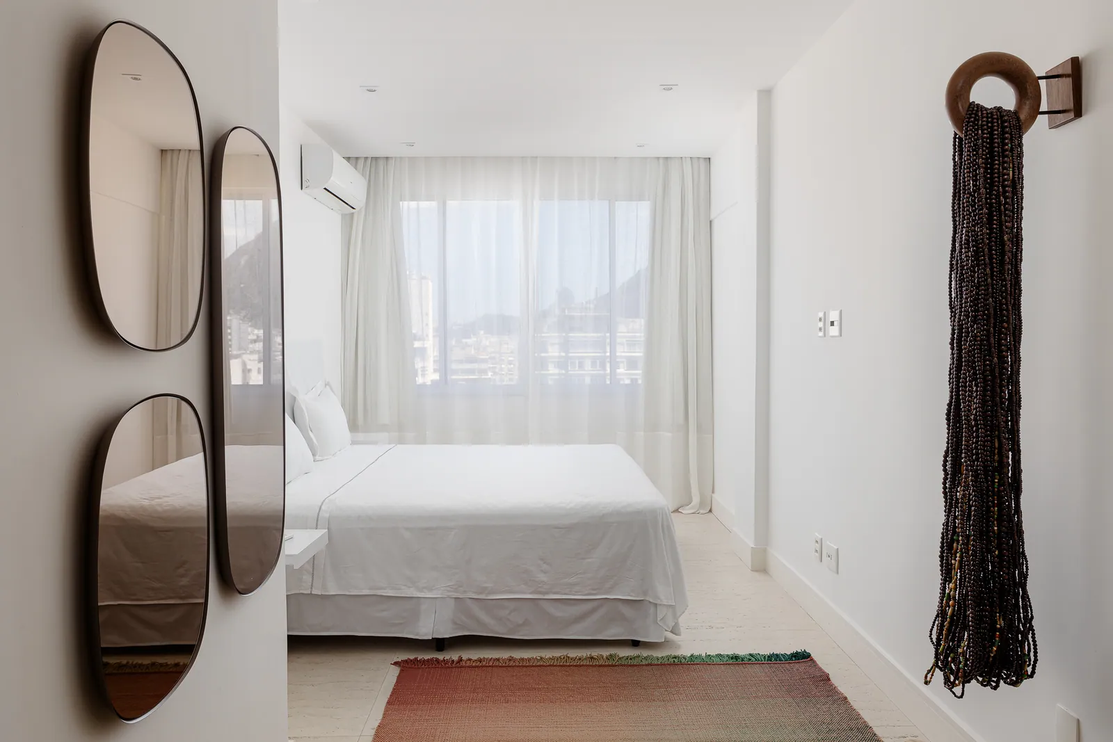 Bedroom with television and sea-facing window